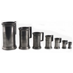 Set of 7 normalised measuring jugs