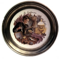 Pewter and faience plate with needlewoman decor