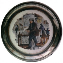 Pewter and faience plate with knife grinder decor