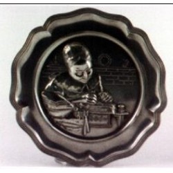 Pewter plate with lacemaker decor